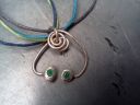 [free-form silver with emerald]