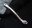 [silver spoon with garnet]
